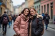 ©  S u n n y B u n n y - Smiling friends in warm winter jackets on a colorful city street
