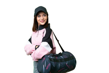 Wall Mural - Young sport woman with sport bag over isolated chroma key background with arms crossed and happy