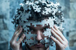 © senadesign - Close up of man with puzzle – challenge and concentration.