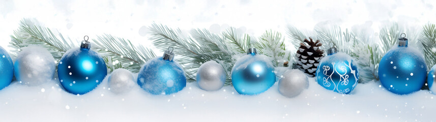 Wall Mural - blue christmas balls in a row with spruce branches covered with snow and snowfall on white backgroun