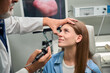 © Viacheslav Yakobchuk - Doctor examines patient's eye with a specialized tool