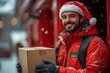 © Khawla - Delivery man with santa costume standing in front of red background