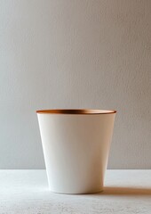 Poster - A white cup with a gold rim sits on a white countertop