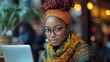 © Irina - Business freelancer young black woman african american girl using laptop computer for work at a cafe. Modern technology with online internet. Remote work, freelance.
