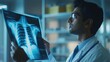 © Lifestyle Images - A doctor is holding a x-ray of a patient's chest