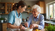 © ON - Studio - Heartwarming moments in the kitchen as a caregiver helps a woman with Alzheimer's prepare a meal in a sunny home