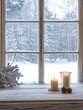 © Agus - Two Burning Candles on a Snowy Window Sill with a Snowy Forest View