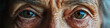 © Lila Patel - Silver Strength: Close-up of elderly woman's determined face