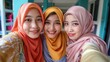 © Custom Media - Friends in Hijabs Taking Selfie