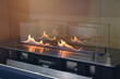 © DmyTo - Fire burns in a modern fireplace.