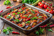 © Afroza - Spicy eggplant chili traybake with herbs, colorful appetizing dish