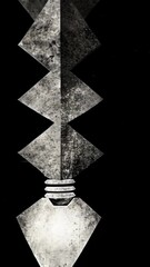 Wall Mural - A lightbulb with a textured surface against a black background, illuminated with a soft glow