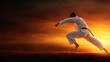 © svastix - A martial artist in a white gi performs a dynamic move against a dramatic sunset background, symbolizing discipline, strength, and the pursuit of excellence.
