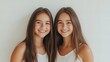 © Chimpanzky  - portrait of smiling teenage twins isolated on white