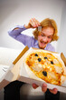 © Voyagerix - Man eating pizza, having fun.