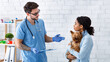© Prostock-studio - Professional veterinarian doctor talking to client in medical office
