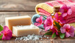 © Sergey - Natural handmade soap,sea salt,  natural cosmetic oil and colorful towels with azalea flowers on rustic wooden background. Healthy skin, body care. SPA and sauna concept. Side view,copy space for te