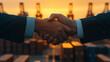 © Wasin Arsasoi - Securing the Deal: A powerful handshake seals a lucrative business agreement against the backdrop of a bustling cargo port at sunset.  The image conveys trust, collaboration, and global trade.