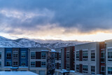 Avon, Colorado small town Mountain Village in winter snow view of Rocky Mountains and modern apartment architecture by Vail