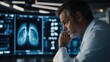 © Steve - Doctor carefully examining lung scan results, focusing on patient's health and medical diagnosis. Professional dedication and attention to detail in healthcare.