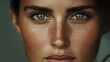 © Alexandra - A close-up portrait of a young woman with striking green eyes and freckles, captured in soft natural light indoors