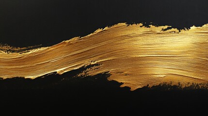 Gold paint brush stroke isolated on black background