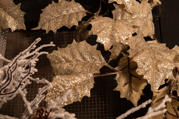 Wall Mural - full frame abstract texture background of an indoor holiday decoration featuring glitter covered lea