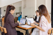 © SOMKID - Asian businesswoman teamwork working on laptop with finances analysis report at desk in office, business financing, accounting banking, Team of creative and business planning,