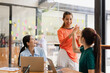 © SOMKID - Excited Asian businesswoman team working together in office, About successful startup projects concept.