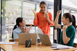 © SOMKID - Excited Asian businesswoman team working together in office, About successful startup projects concept.