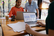 © SOMKID - Technology and financial advisory services concept. Businesswoman teamwork and working on digital laptop computer with advisor showing plan of investment to clients at table office. Digital marketing.