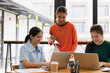 © SOMKID - group of asian businesswoman working on laptop with finances analysis report at desk in office, business financing, accounting banking, Team of creative and business planning,