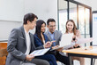 © SOMKID - Asian business teamwork working with analysis report and advisor showing plan, Financial analysis and Marketing teamwork concept.