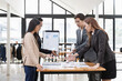 © SOMKID - Asian business teamwork working with analysis report and advisor showing plan, Financial analysis and Marketing teamwork concept.