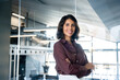 © Stock 4 You - Portrait of beautiful successful hispanic young business woman with crossed arms smiling at camera. Latin or eastern confident middle age female ceo leader businesswoman standing in office. Copy space