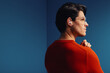© Jacob Lund - Man wearing wireless earbuds in colorful studio shot