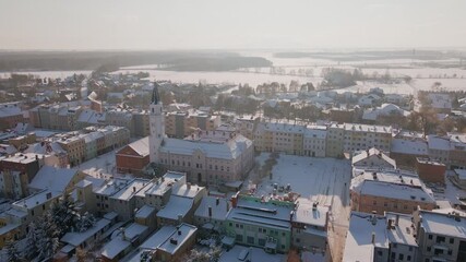 Wall Mural - Aerial view of city center covered in snow. Winter season in small European town