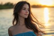 © Vii - A young woman stands near the water's edge, enjoying the scenery