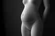 © alexandr - Closeup of a pregnant woman's torso in grayscale hands gently resting on her belly symbolizing motherhood