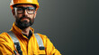 © kongkiat chairat - confident technician in safety helmet and glasses, wearing bright yellow work uniform, ready for offshore tasks