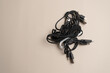 © Анастасия Терентьева - Bundle of assorted black cables tangled together, illustrating the complexity of cable management
