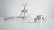 © Nataliia - Different steel kitchen items on white table and white background