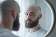 © Alexandr Efimov - Man looking in mirror with beard