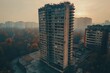 © Muekdum Studio - Desolate Highrise: An evocative drone shot captures a decaying highrise building amidst a hazy cityscape, hinting at urban decay and forgotten stories.