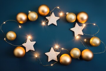 Aufkleber - Golden Christmas ornaments and white stars with fairy lights on a dark blue background.
