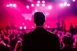 © Guy - Man in Suit Silhouetted Against Pink Stage Lights at Concert