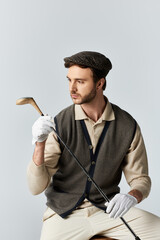 A dapper gentleman in vintage attire prepares for a round of golf in a stylish indoor setting