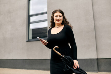 A stylish young woman walks confidently with an umbrella on a crisp autumn day, embracing the changing season.