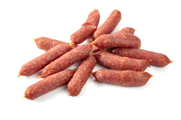 Poster - Small dry-cured sausages isolated on white.