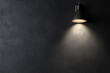 © Aisyaqilumar - A light shining on a wall with a dark background. The light is casting a shadow on the wall